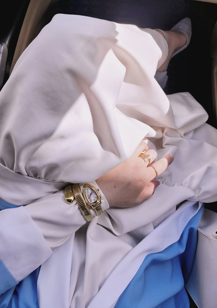 A close-up of a stylish wristwatch on a woman